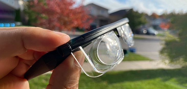 DeeFocus man holding the glasses in his backyard